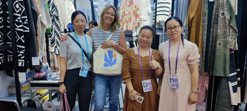 Dongguan knitwear supplier BENTA with international customers at Canton Fair booth