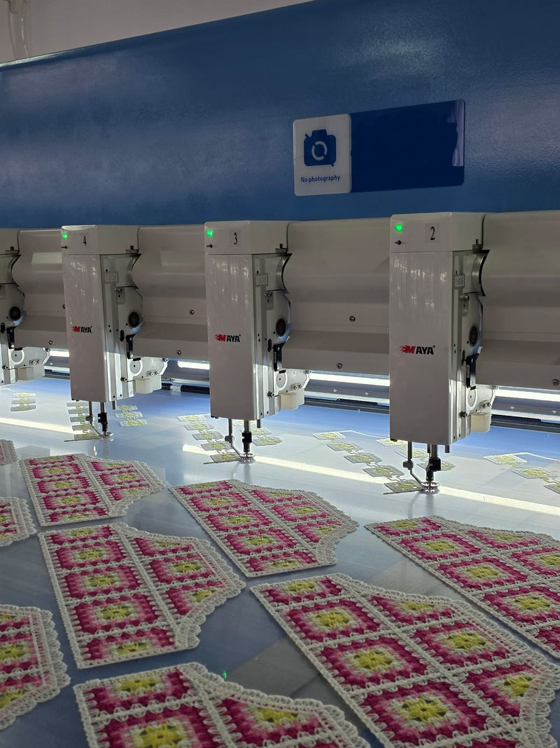 BENTA factory workshop, multi-head automatic embroidery machine producing handmade crochet granny square fabric panels, textile OEM production line.
