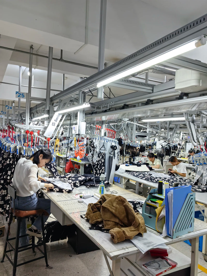 BENTA factory interior, clothing production workshop with workers on assembly line, OEM crochet knitwear manufacturing workshop.