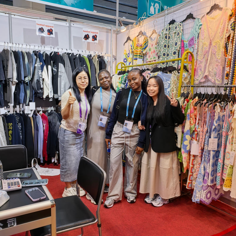 Professional knitwear manufacturer BENTA taking photos with global wholesale partners at Canton Fair